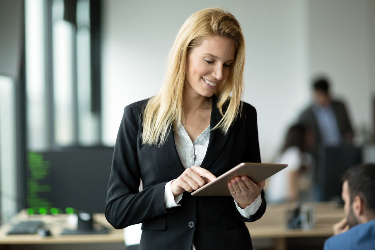 Businesswoman using tablet at IT place
