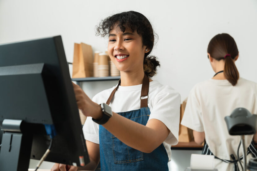 Person at cashier uses a point of sale terminal